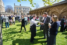 A drinks receptiojn taking place in Peterborough Cathedral Cloisters
