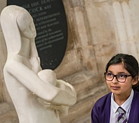 Child looking at statue